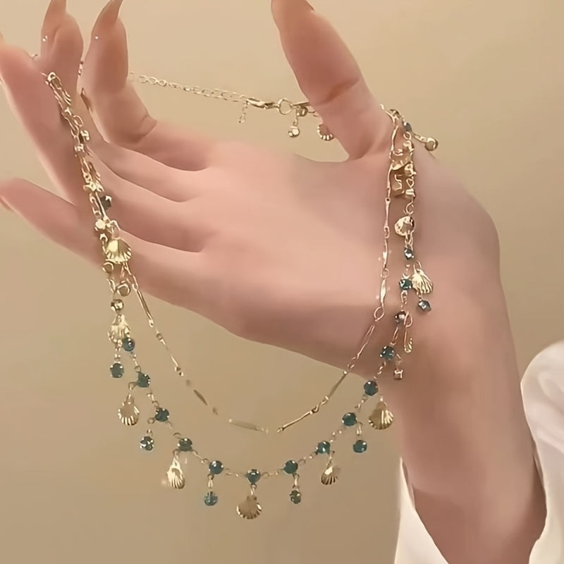2 piece Blue Zircon and Golden Shells
