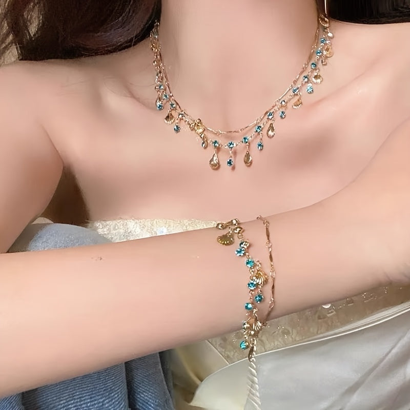2 piece Blue Zircon and Golden Shells