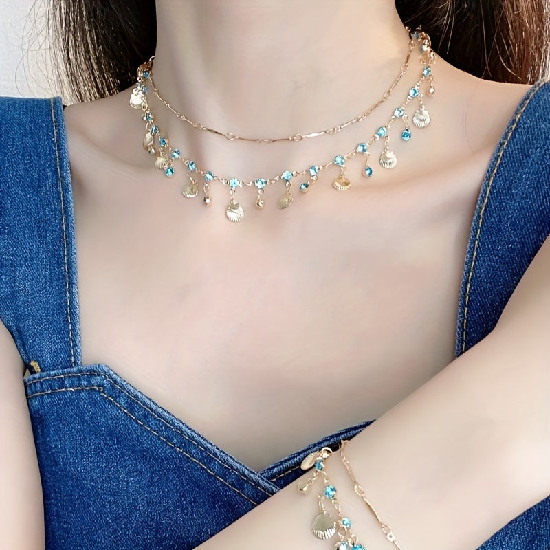 2 piece Blue Zircon and Golden Shells